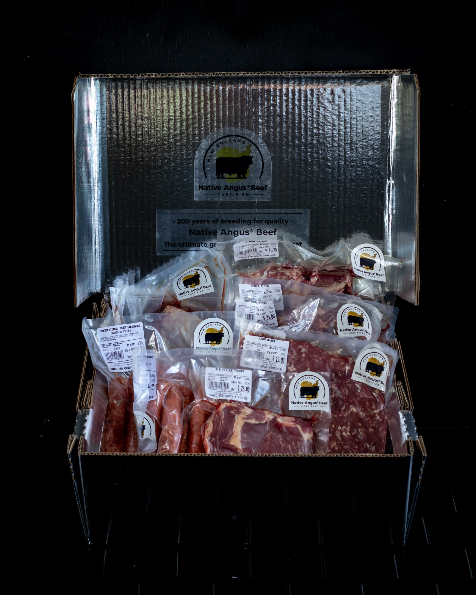 An open Native Angus Beef box holding labelled packs of beef.